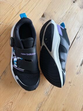 New Balance Kids Black Sneakers with Purple and Blue Accents